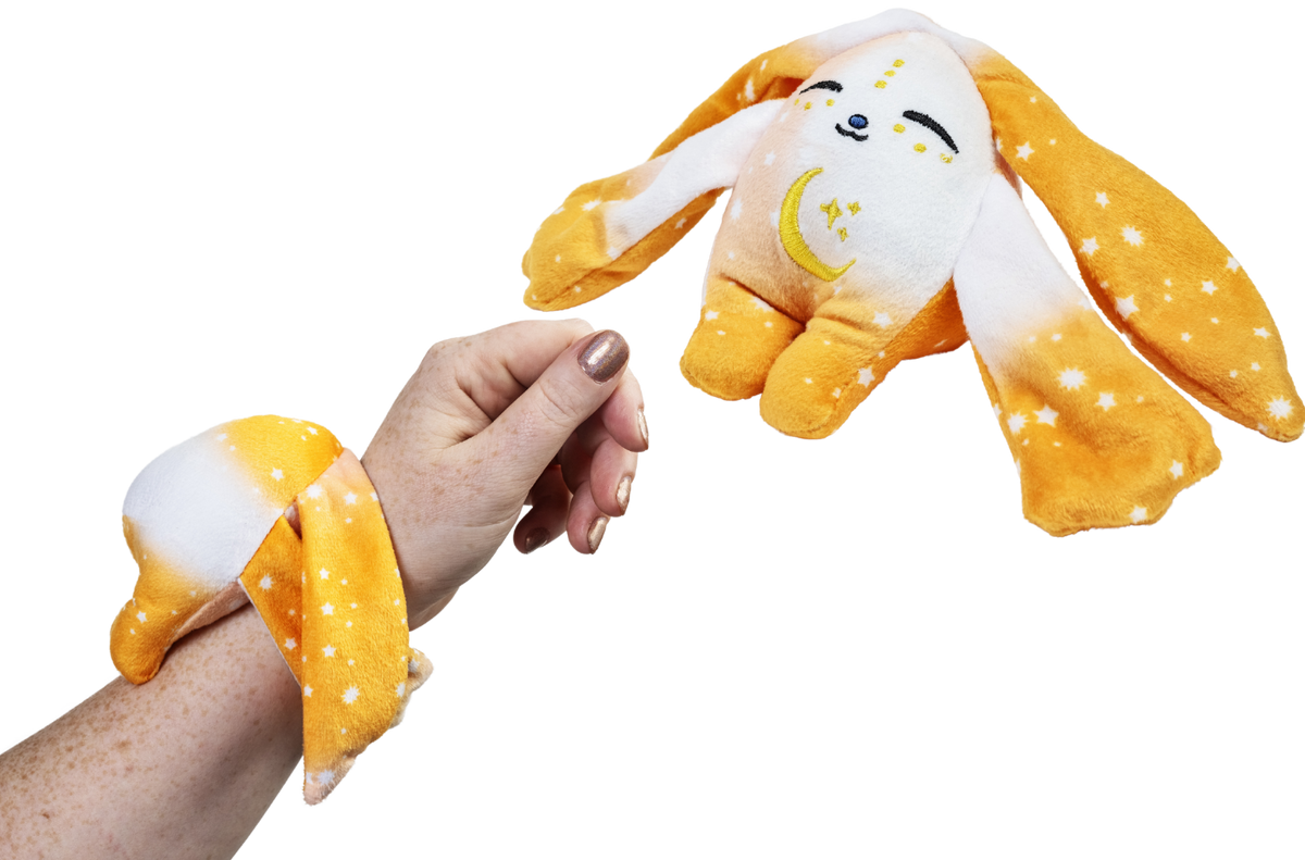 Ori Mini Wrist Hugger, a small yellow Moon Pals wrist plush