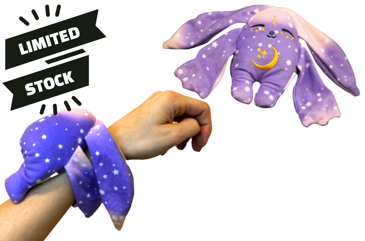 Polli Mini Wrist Hugger, a small purple Moon Pals wrist plush